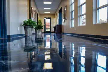 Reflective deep-blue floor along a corridor